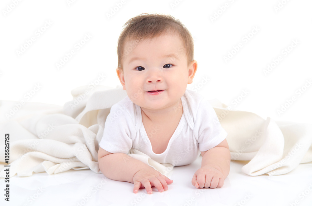 Asian baby lying on the floor