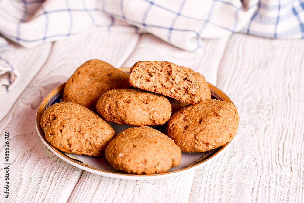 pile of oat cookies on wooden table