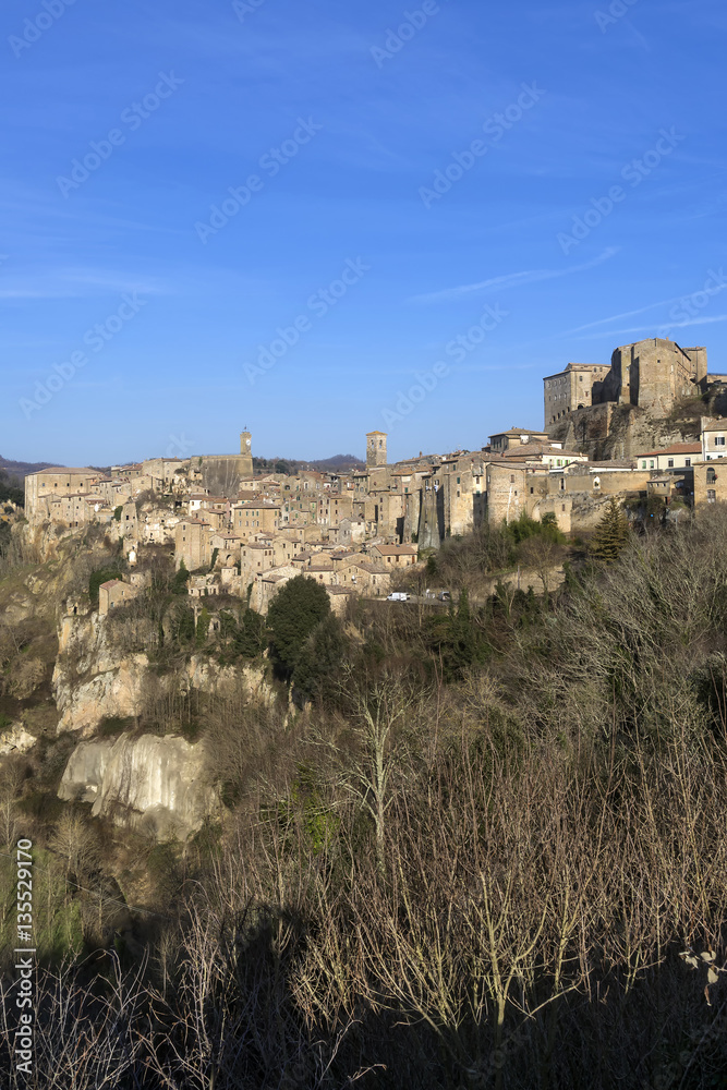 Beautiful vertical view of the tuff village of Sorano, in the Maremma of Grosseto, Grosseto, Toscano, Italy