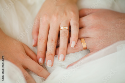 Wedding Rings on Couple Hands  Bridal White Dress