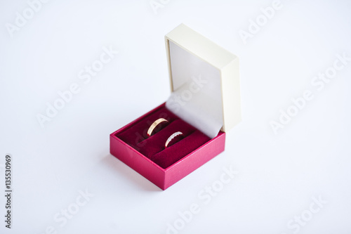 Wedding Golden Rings in red box Isolated on White.