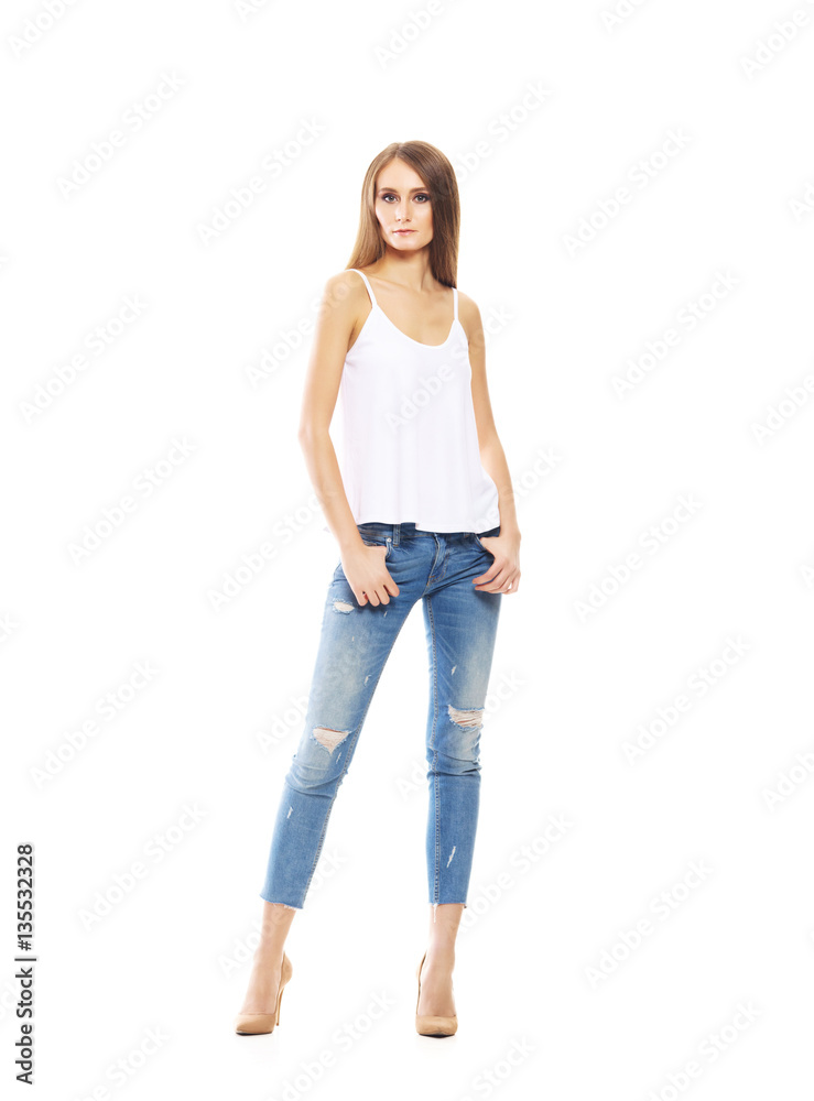 Beautiful and sexy woman in stylish jeans isolated on a white ba Beautiful and sexy woman in stylish jeans isolated on a white ba