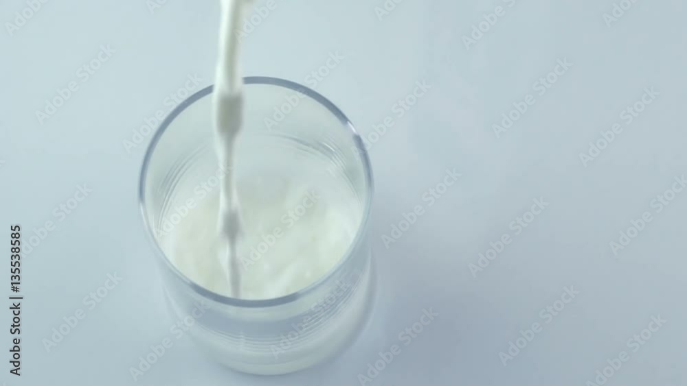 Pouring milk into glass shooting with high speed camera, Top view
Pouring milk into glass shooting with high speed camera, Top view