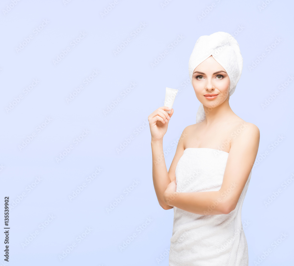 Young, beautiful and natural woman wrapped in towel isolated on Young, beautiful and natural woman wrapped in towel isolated on