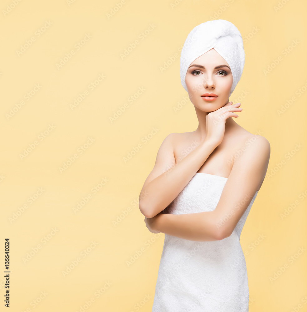 Young, beautiful and natural woman wrapped in towel isolated on Young, beautiful and natural woman wrapped in towel isolated on