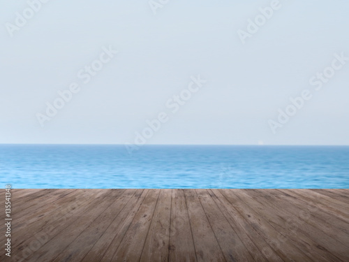 Dark timber foreground with sea scape background