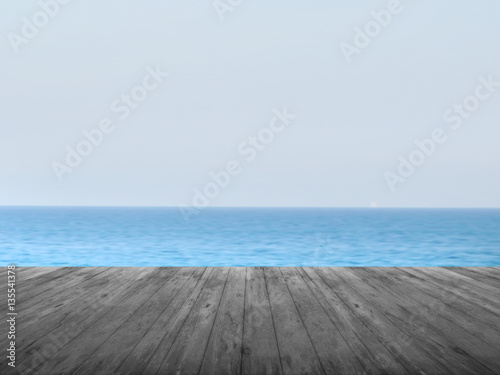 Dark timber foreground with sea scape background