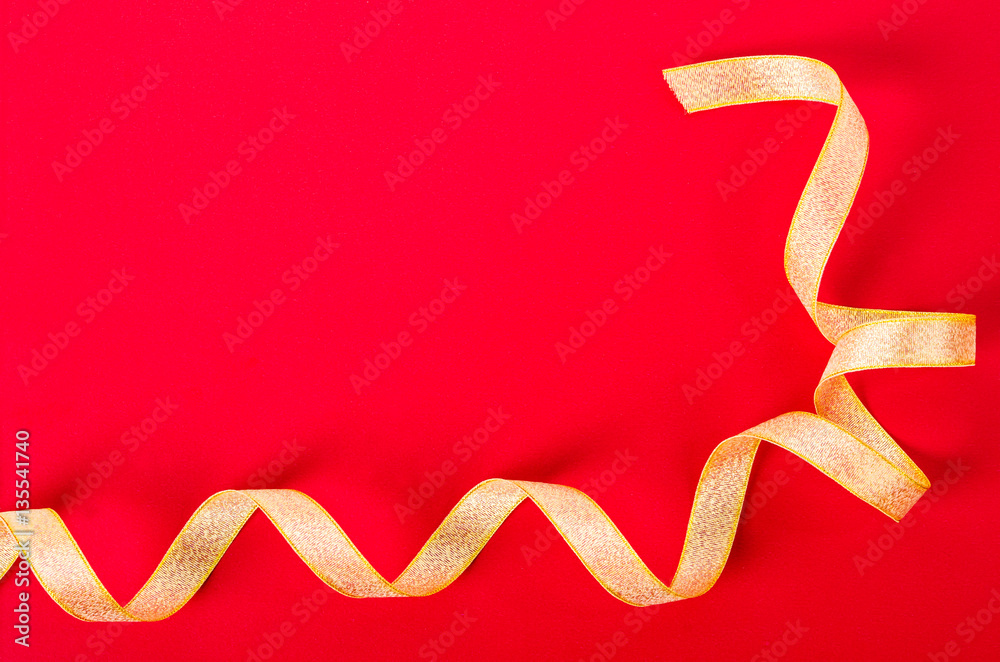 Golden ribbon on red background. Golden ribbon on red background.