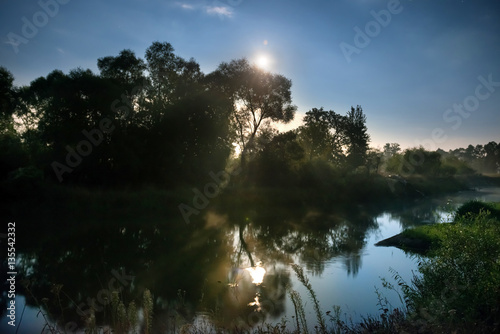 Sunrise on river photo