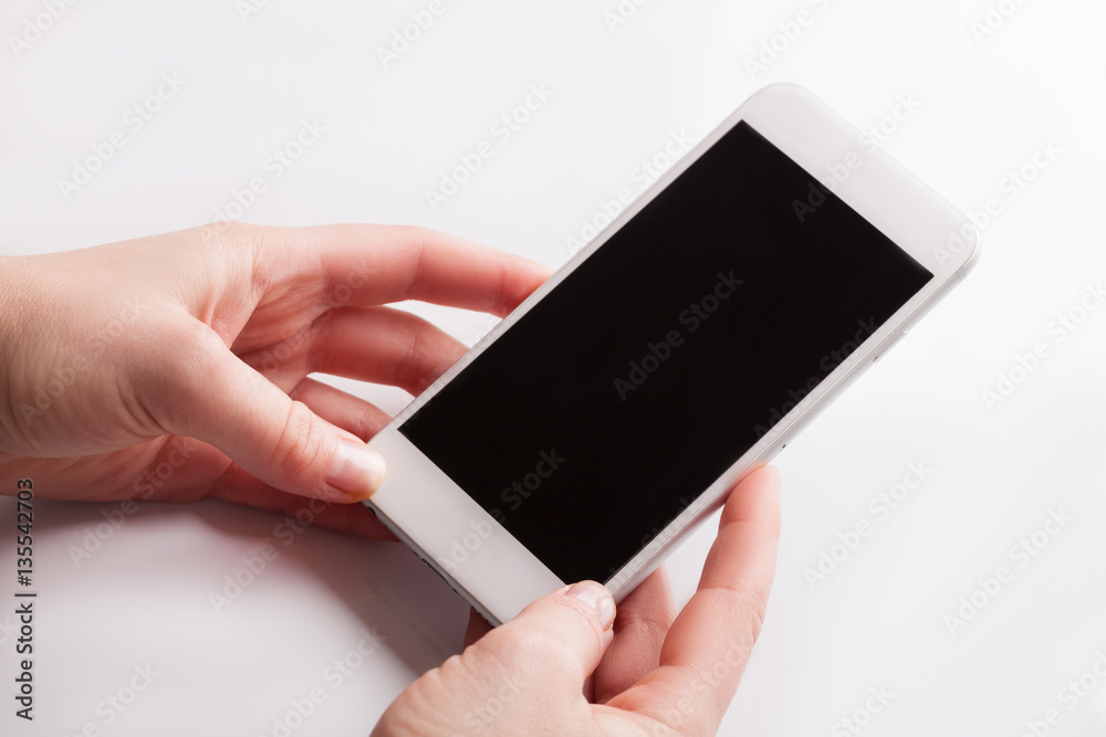 Hand holding and Touch on White Smartphone with blank screen