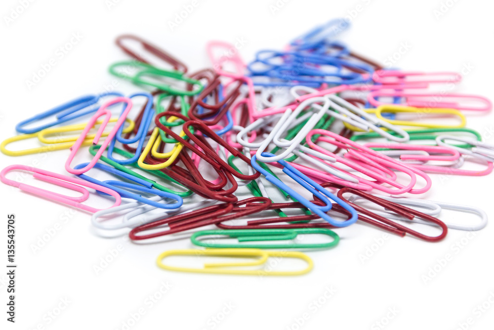 multi-colored paper clips on white background multi-colored paper clips on white background