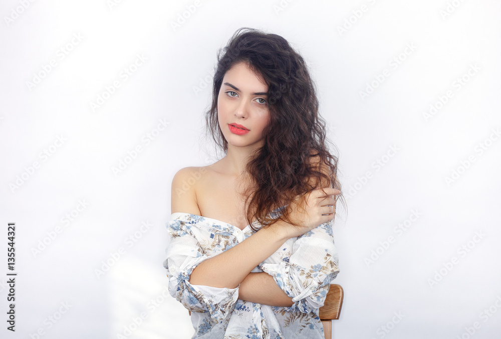 Beauty portrait of young adorable fresh looking brunette woman with crossed hands. Emotion and facial expression concept. Beauty portrait of young adorable fresh looking brunette woman with crossed hands. Emotion and facial expression concept.