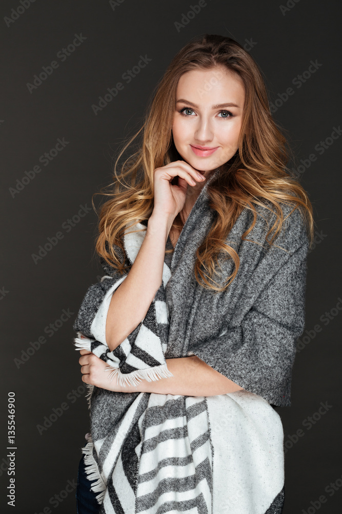 Cheerful lady posing over dark background Cheerful lady posing over dark background