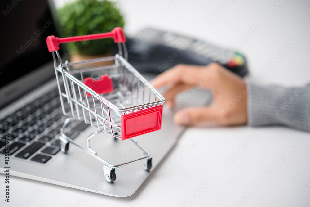 Online shopping concept. Mobile phone or smartphone with cart