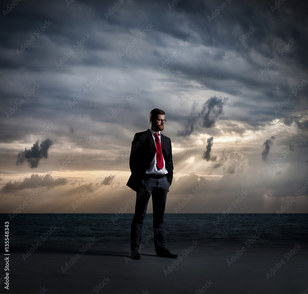 Businessman in suit and tie. Black background with copyspace. Bu Businessman in suit and tie. Black background with copyspace. Bu