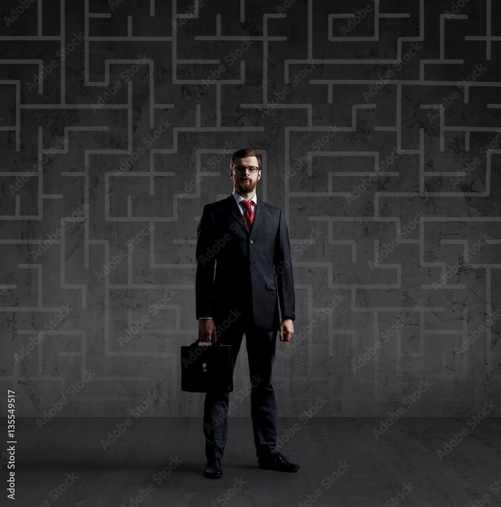 Businessman in suit and tie. Black background with copyspace. Bu Businessman in suit and tie. Black background with copyspace. Bu