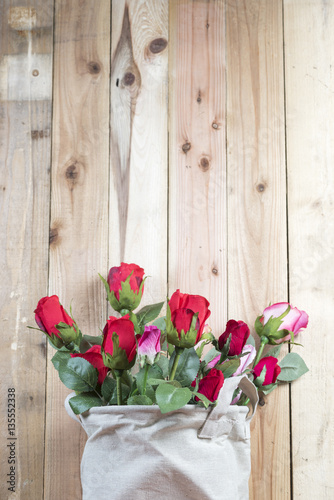 Fototapeta Naklejka Na Ścianę i Meble -  rose flower on wooden wall background
