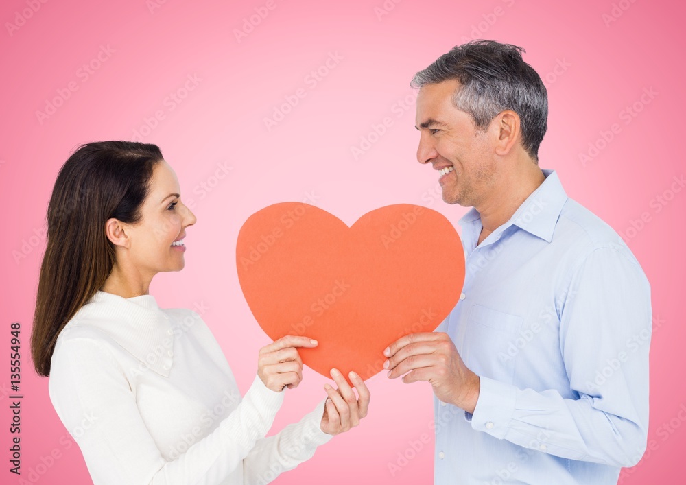 Romantic couple holding heart shape