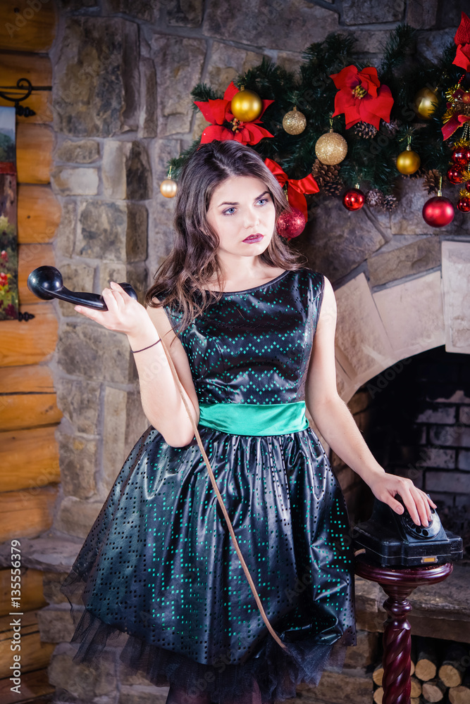 brunette near the fireplace