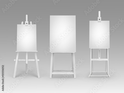 Set of White Wooden Easels with Mock Up Empty Blank Vertical Canvases Isolated on Background