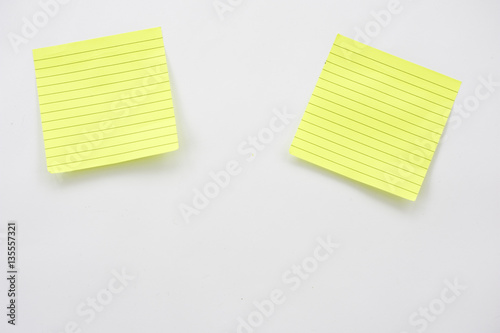 Yellow post its on white background