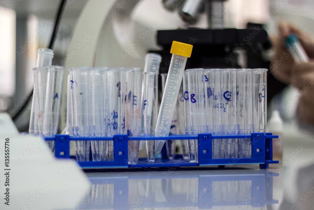 Modern scientist working in biotechnological laboratory equipmen