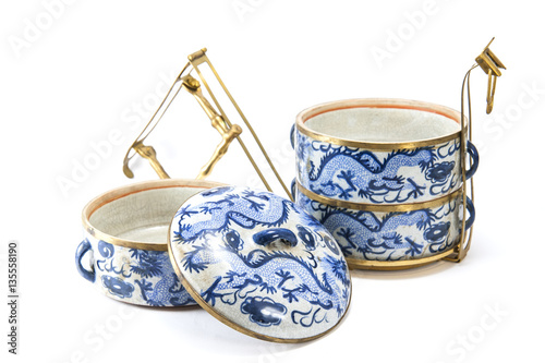 Vintage tiffin with chinese blue pattern on white back ground photo