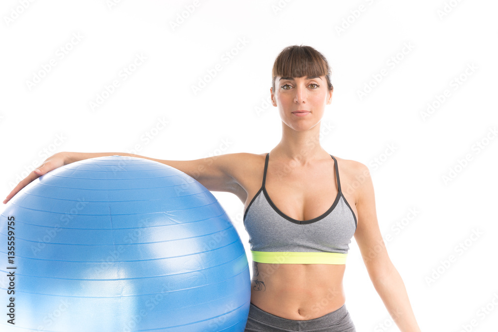 Beautiful fitness girl with blue ball isolated on white. Beautiful fitness girl with blue ball isolated on white.