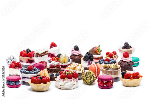 Selection of miniature cakes, macrons, cupcakes and treats
