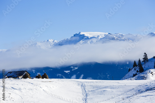 Homes in the mountains in winter landscape