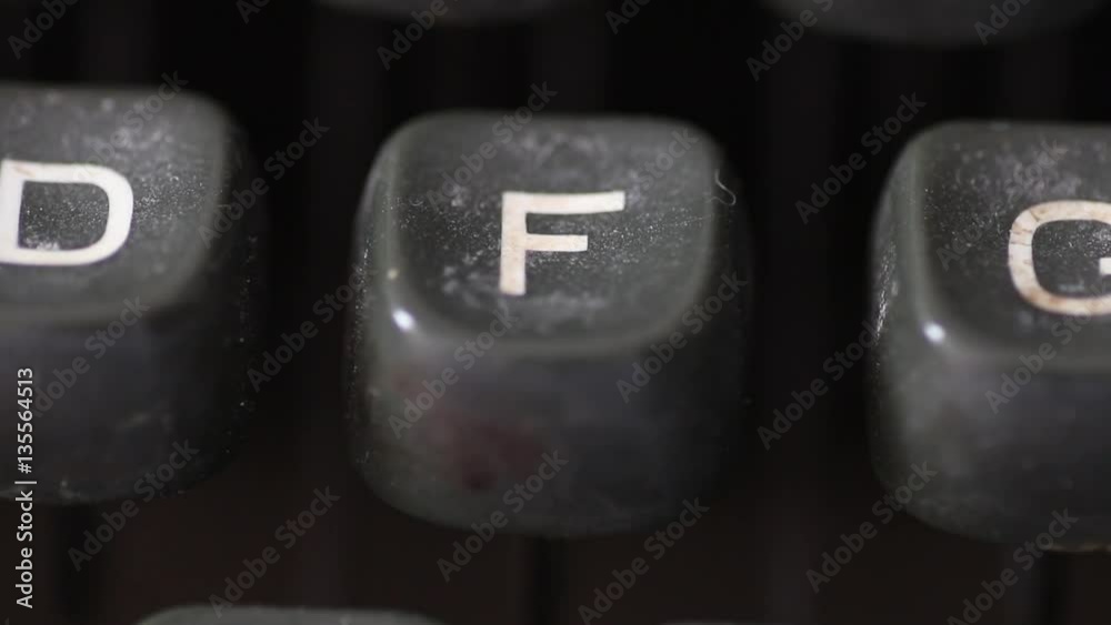 Macro shot on the letter F key typed on an old vintage typewriter ...