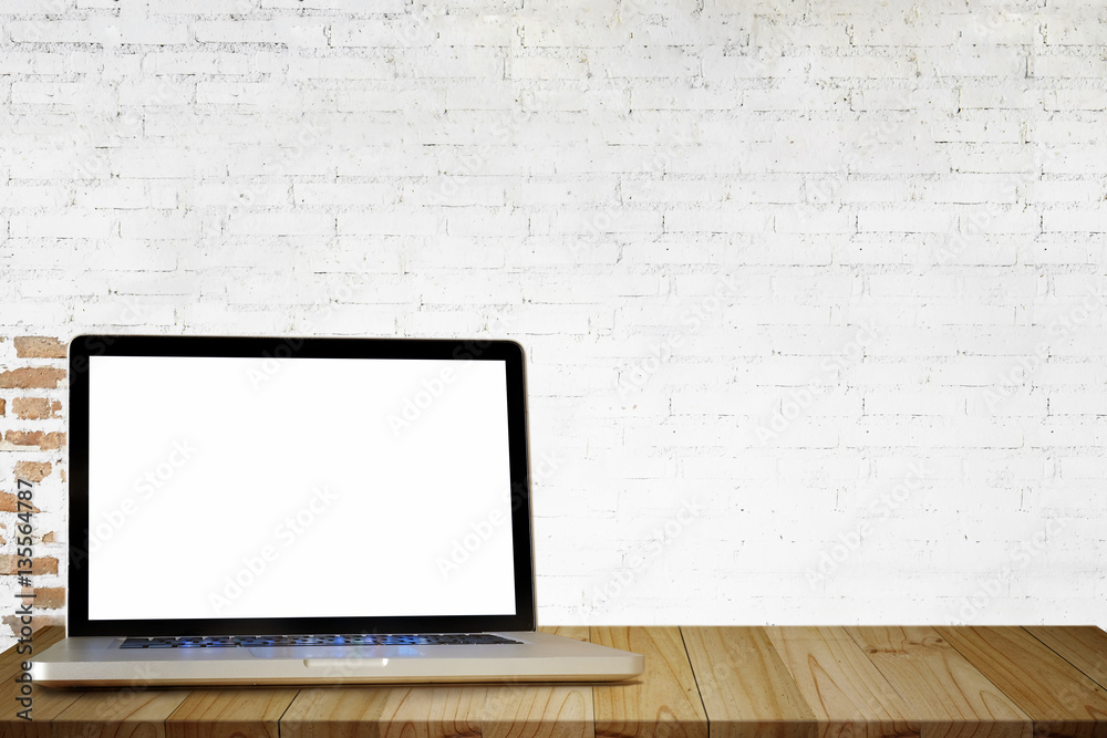 Mock up Blank screen laptop on wooden table with white brick wall. For product display. Mock up Blank screen laptop on wooden table with white brick wall. For product display.
