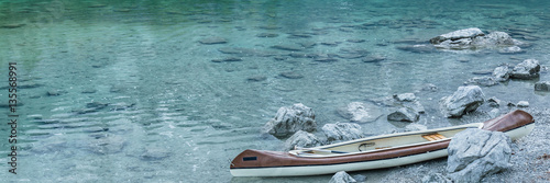 Canoe on calm blue lake, Aibsee, Germany