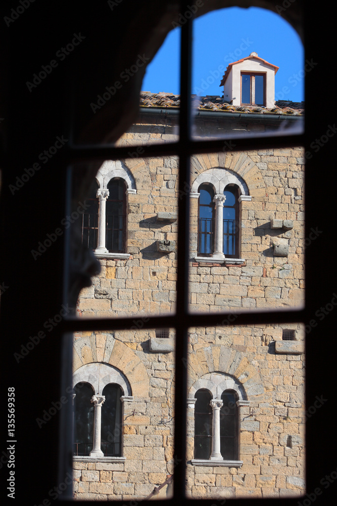 Fototapeta premium Foreshortening of Volterrra framed in a window, Pisa, Tuscany, Italy