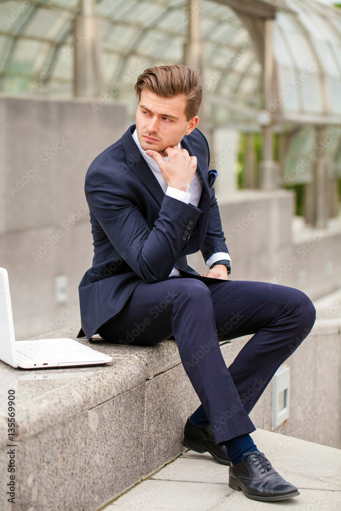 Portrait of a cheerful businessman with laptop Portrait of a cheerful businessman with laptop