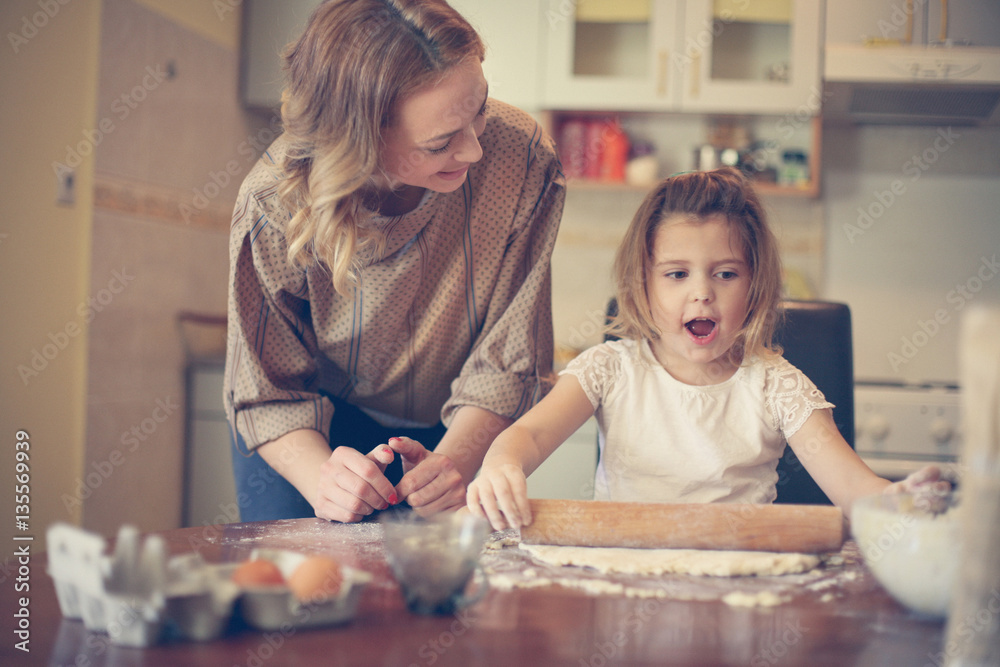 Mother and daughter baking cookies. Mother and daughter baking cookies.