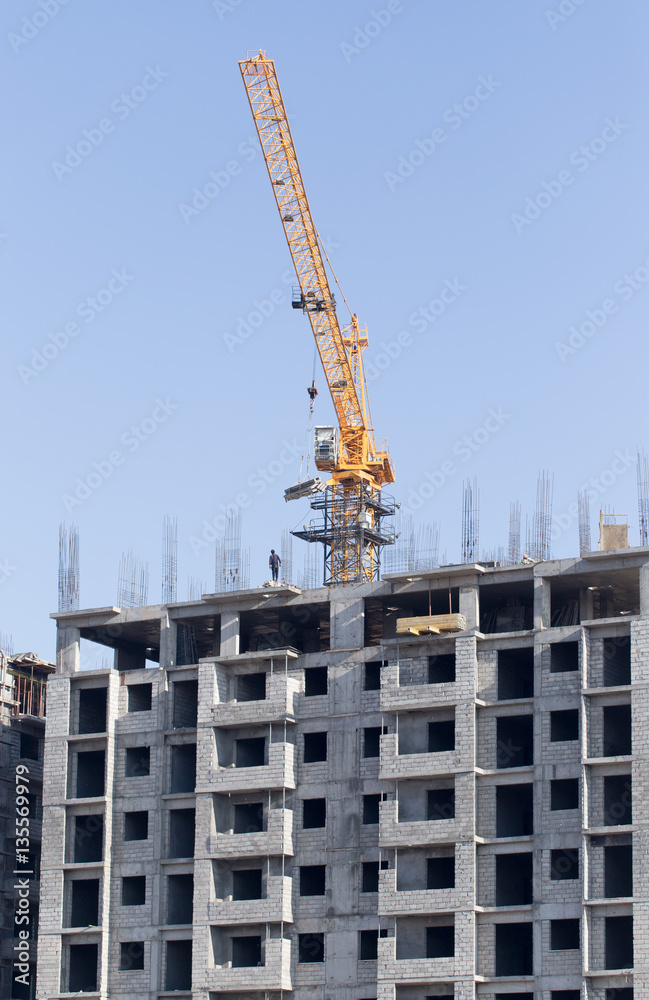 Crane building a multi-storey building