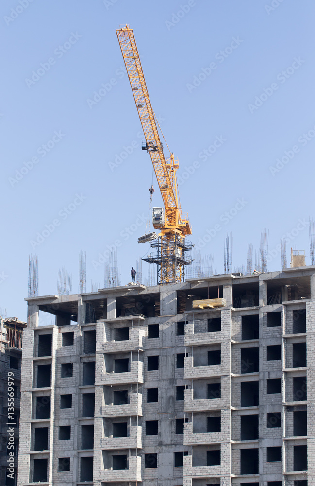 Crane building a multi-storey building Crane building a multi-storey building
