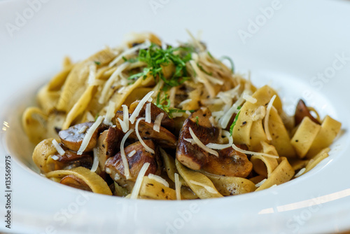 Fresh delicious Mushroom pasta in a white plate