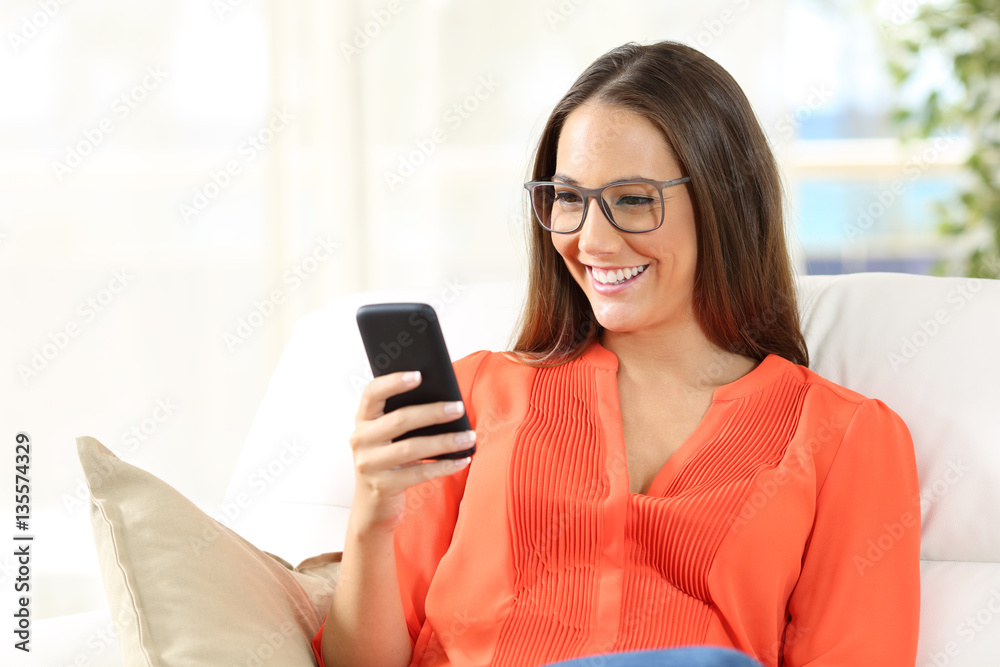 Woman with eyeglasses using a smart phone Woman with eyeglasses using a smart phone