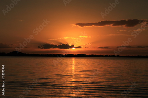 Sunset over water © Colleen