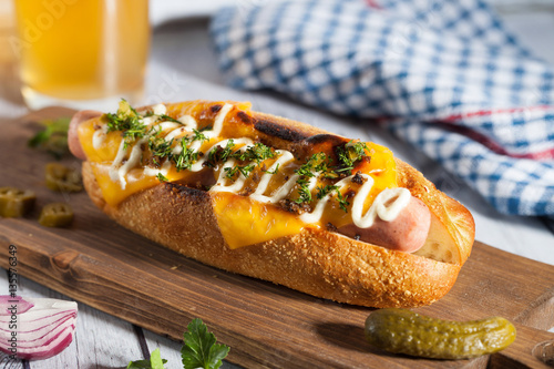 Hot dog with cheese and beer photo