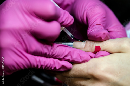Application basics for gel nail polish. Elongation nail through the gel.