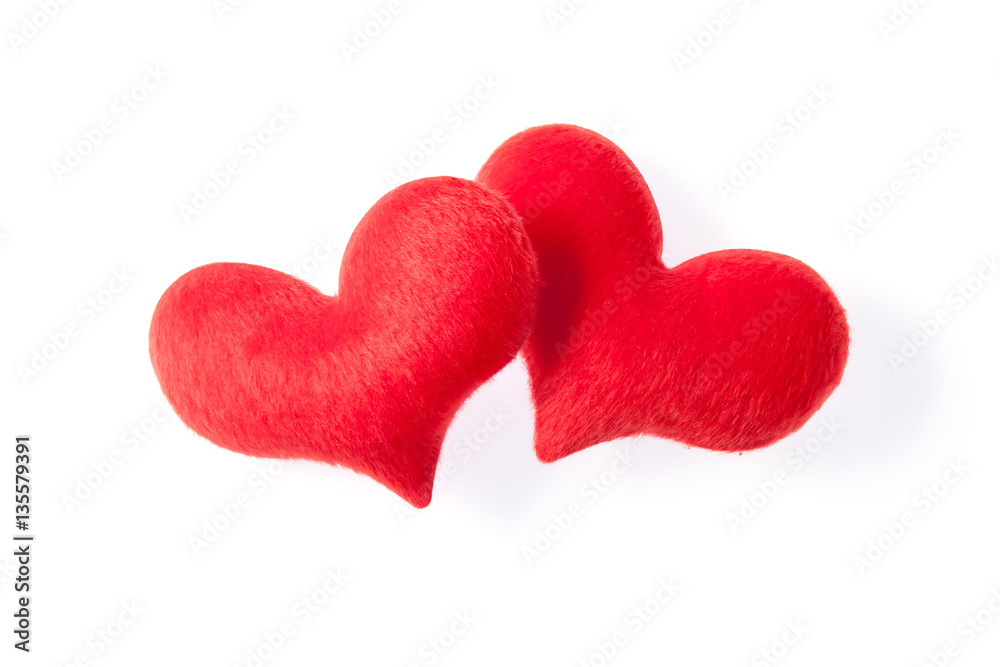 two red heart made of fur on white background