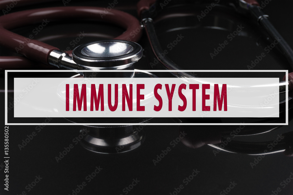 Obraz premium Stethoscope on black background with text IMMUNE SYSTEM