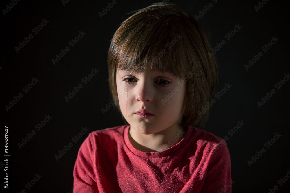Sad little child, crying, hugging stuffed toy Sad little child, crying, hugging stuffed toy