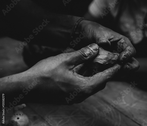 hands with clay