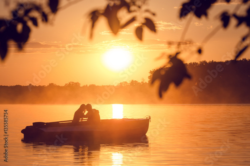 Obraz na plátně Love and romantic golden river sunset