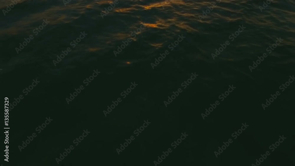 Sunset in the middle of the ocean with quadrocopters in slow-motion Sunset in the middle of the ocean with quadrocopters in slow-motion