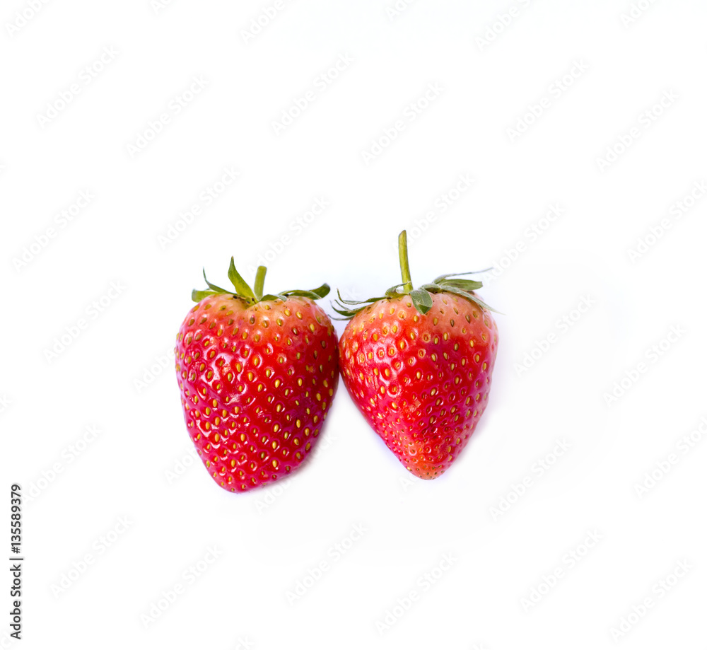 Two red strawberries on white background Two red strawberries on white background